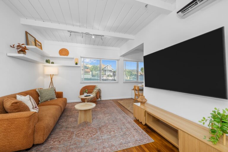 Casa Brisa living room with 70-inch smart TV and lounge chairs