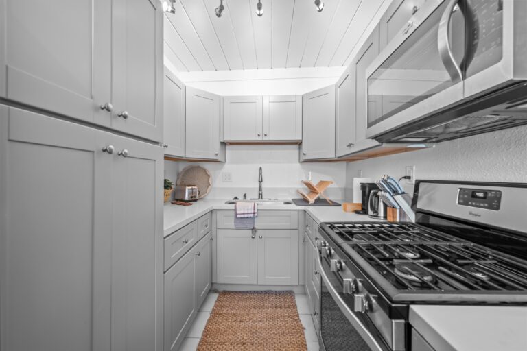Casa Brisa kitchen with gas range and white cabinets