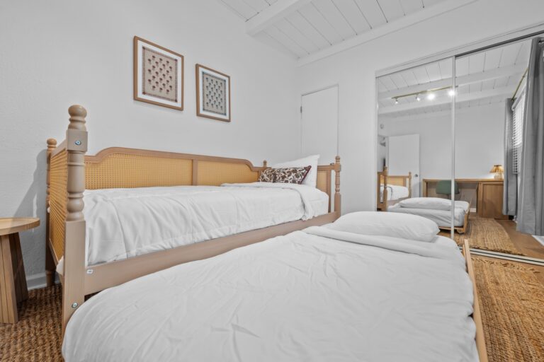Casa Brisa bright bedroom with wood-frame bed