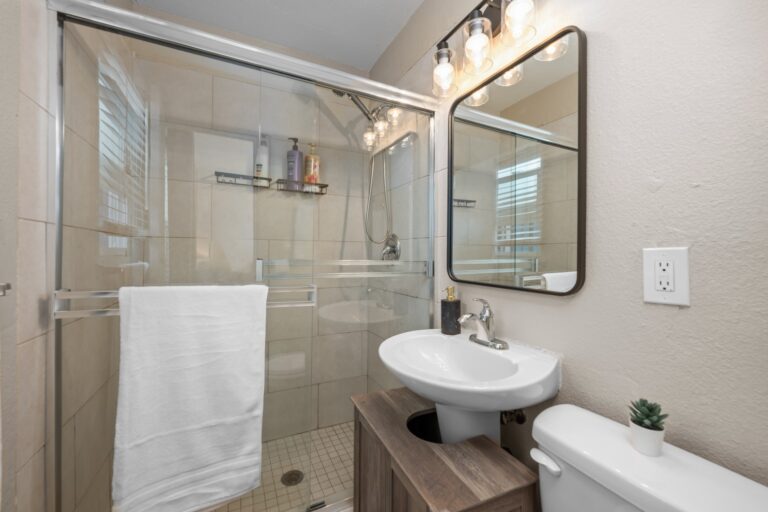 Casa Sol bathroom with glass shower and vanity