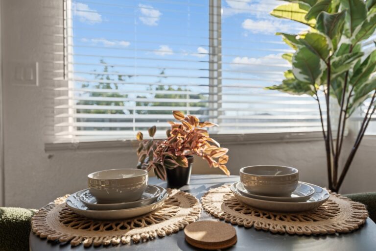Casa Sol dining table set for two by the window